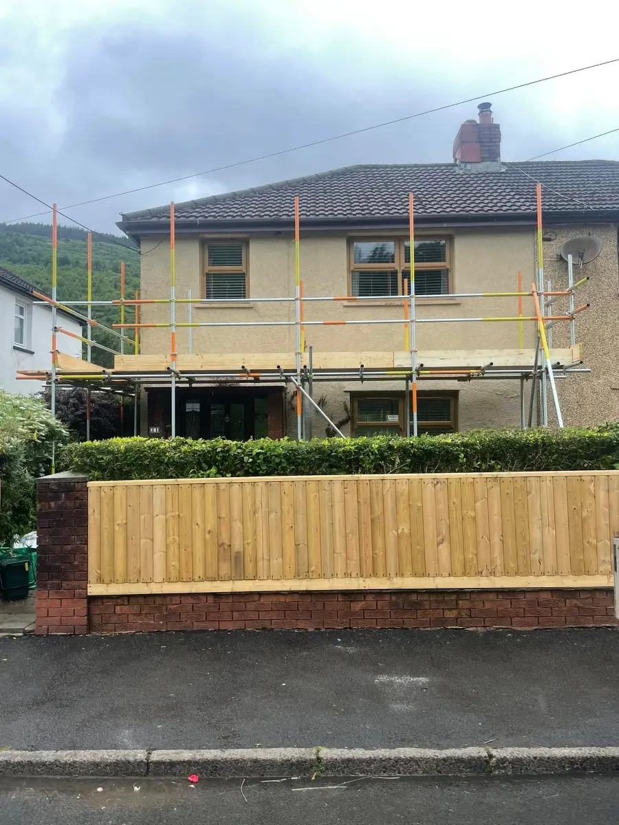Scaffold guardrails and toe boards on a semi-detached house