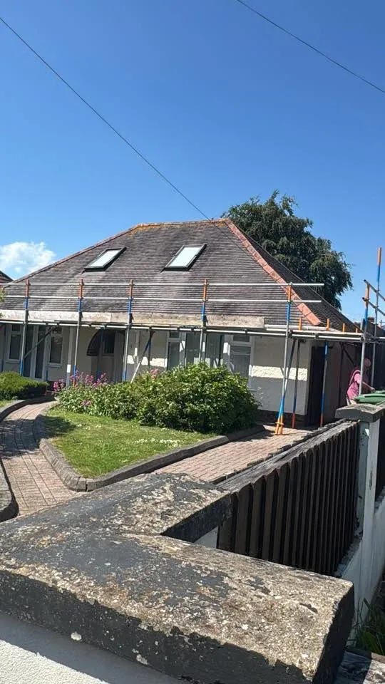 Roof scaffolding around a bungalow for roofing work